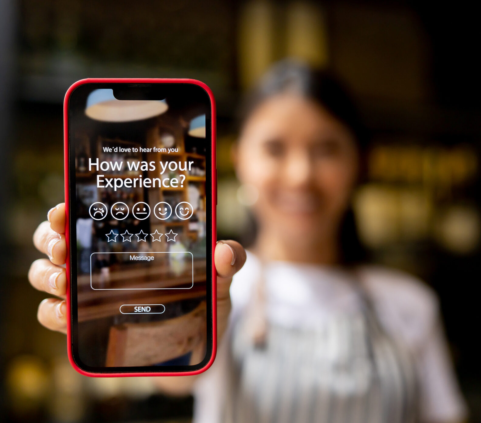 Waitress displaying an app to rate your experience at a restaurant â food and drink industry concepts